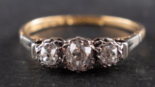 A cushion-cut diamond three-stone ring, total estimated diamond weight ca. 0.
