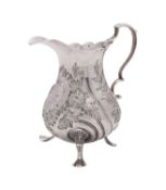 A George III silver cream jug, maker's mark rubbed, London 1765, of baluster form,