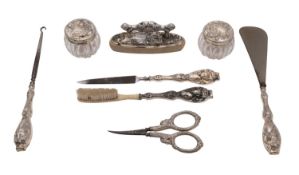An early 20th century American Art Nouveau silver lady's dressing table set, stamped Sterling,