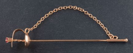 A Soviet, sword tiepin, with a synthetic ruby to finial and Soviet control stamps for 14ct gold,
