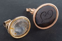 Two seal fobs, including a brown glass seal fob, engraved with initial 'T', total length ca.