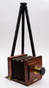 An early 20th-century mahogany and brass half plate camera, maker Stereoscopic Co. Ltd.