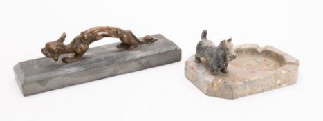 A cold painted metal terrier onyx base ashtray;