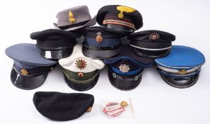A group of various Foreign Police peaked caps, including a German Motorway Patrol cap,