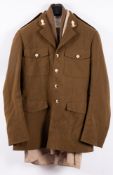 A Royal Artillery Uniform comprising peaked cap jacket, trousers, shirt and tie,