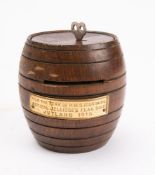 HMS Iron Duke. A teak barrel shaped money box and key, made from reclaimed ship's timbers.