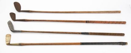 A group of four hickory shaft golf clubs, comprising a Percy Baxter Nilblick,