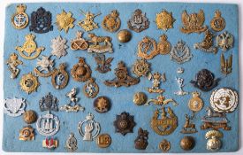 A collection of various regimental cap badges, including 25th Hussars,