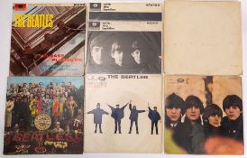 A collection of 6 LPs by The Beatles,