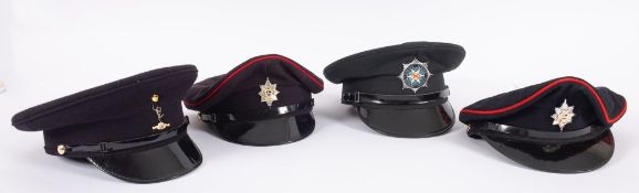 A group of four peaked caps including,