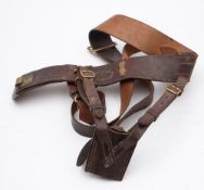 A brown leather Sam Browne belt.