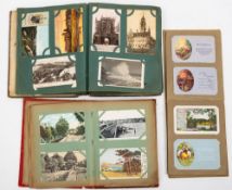 Three early 20th century postcard albums and contents, GB and Foreign topographical, including IOW,