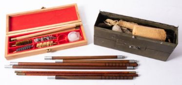 Two shotgun cleaning kits together with four boxes of various cartridges.