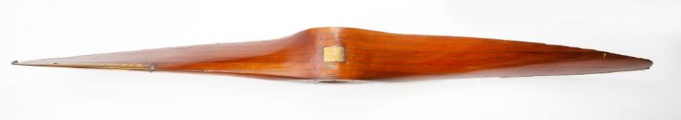 A WWI period propeller, with brass tipped leading edges and brass plaque to boss ' DRG Z3934/3.
