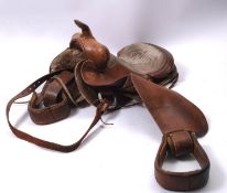A brown leather Western style saddle, 55cm long.