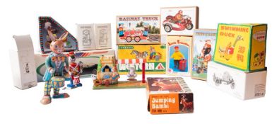 A boxed group of 20th century tinplate and other mechanical toys, mainly German and Japanese.