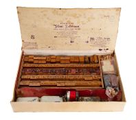 An early 20th century 'Silent Salesman' retailer's printing set with upper and lower case Alphabet,