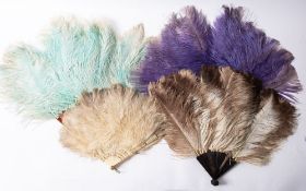 A group of four ostrich feather fans,