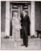 A pair of framed black and white photographs of King George VI and Queen Elizabeth The Queen Mother