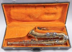 A Melody Maker brass and nickel plated tenor saxophone in fitted case.