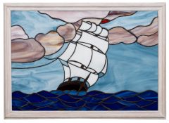 A stained glass panel of a sailing ship, maker Mark Hawler, Teignmouth: set full sail on a swell,