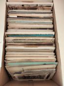 A collection of various postcards and photographs.