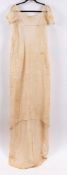 A Regency Dress, circa 1810-1820, the white muslin dress with rounded neckline,