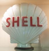 A Shell double sided glass petrol pump globe, maker Hailware, red text, on a moulded body,