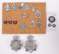 A collection of various Police cap badges together with a Leicester and Rutland helmet plate and a