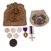 A Purple Heart, together with a reproduction Military Cross,
