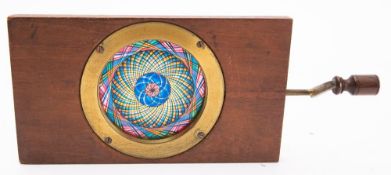 A 19th century Chromotrope, unsigned, with blue, yellow, pink and black kaleidoscope effect.