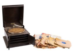 An Early 20th century Regal table top gramophone, together with a small collection of 78rpm records.