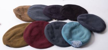 A group of nine various berets, including UN,