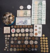 A quantity of assorted world coins including silver bank notes, first day covers, etc.