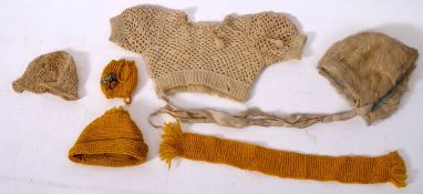 Two late 19th/ early 20th century doll's white fur coats, both with mother of pearl buttons,