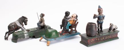 Cast iron money boxes, three reproduction money boxes of Dentist,