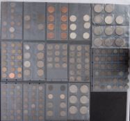 A collection of world coins on sheets, including 1921/22 USA dollars, Kennedy half dollars,