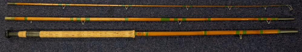 A Hardy 'Lightweight' three piece split cane rod No. G30930 in blue canvas bag.