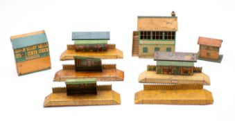 An unboxed group of Hornby O gauge platforms and signal boxes,