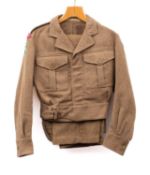 A post war 1949 pattern RAMC battle dress blouse and trousers, the blouse by S R Goldman, London,