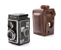 A Zeiss Ikon 'Ikonflex' twin lens reflex camera in leather case, fitted Tessar 75mm f 1;3.5 lens .