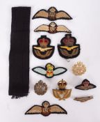 A WWI RFC cap badge, together with a small collection of later RAF cloth badges and patches.