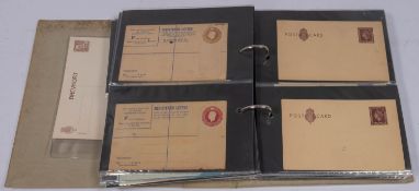 An album of mostly unused postal stationary, including GB from QV to ERII.