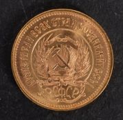 A Russian Chervonets gold coin.