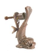 A small brass dolphin door knocker by Cutajar Works, Malta, stamped as per title, 10.5cm high.