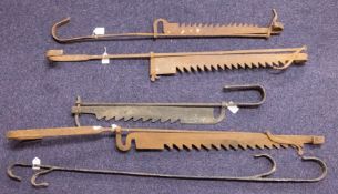 A group of four iron adjustable pot hooks and an iron chimney hook: (5)