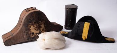 A late 19th /early 20th century black felt bicorn hat, with gold braid satin trunk,