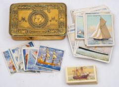 A WWI 1914 Christmas tin, together with two part sets of Wills and R J Hill cigarette cards.