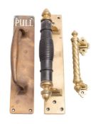 An early 20th century bronze door handle inset white enamel 'Pull', 30 x 6.