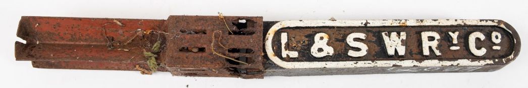 A L & SWR Ry, Co. cast iron boundary marker, highlighted in white to one side, 43cm long.